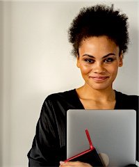 A professional smiling confidently at work