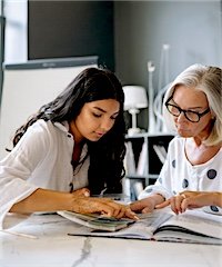 Two colleagues working through a document side by side