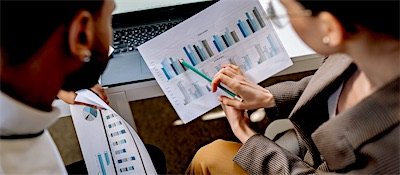 Two people reviewing a document together
