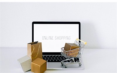 An online store on screen with parcels ready to ship