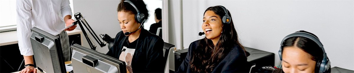 iFOVS agents working with headsets at their desks