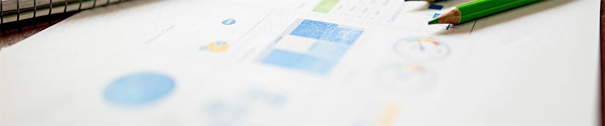 Analytics charts and reports laid out on a desk