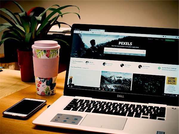 A website open on a laptop beside a phone showing the same site