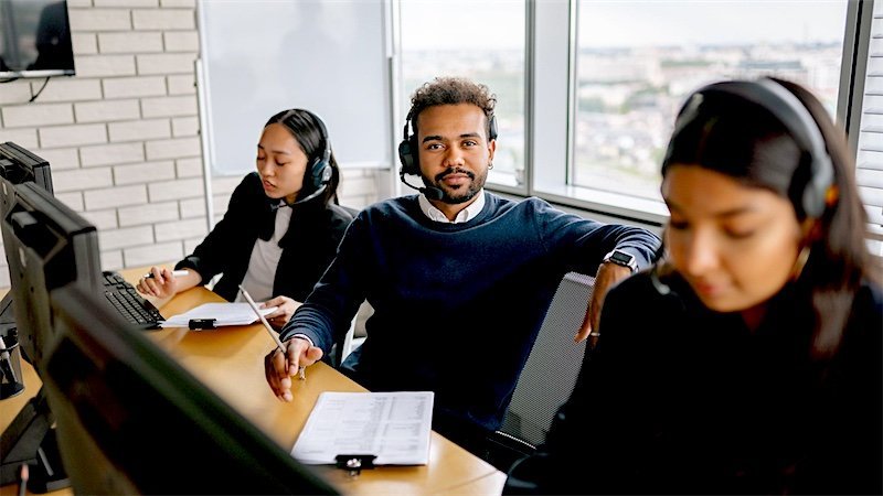 A business support team working together in an office