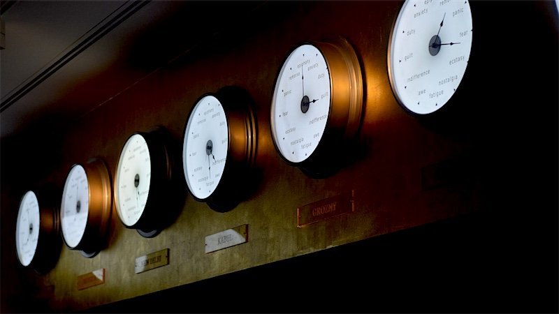 Clocks showing different time zones on an office wall
